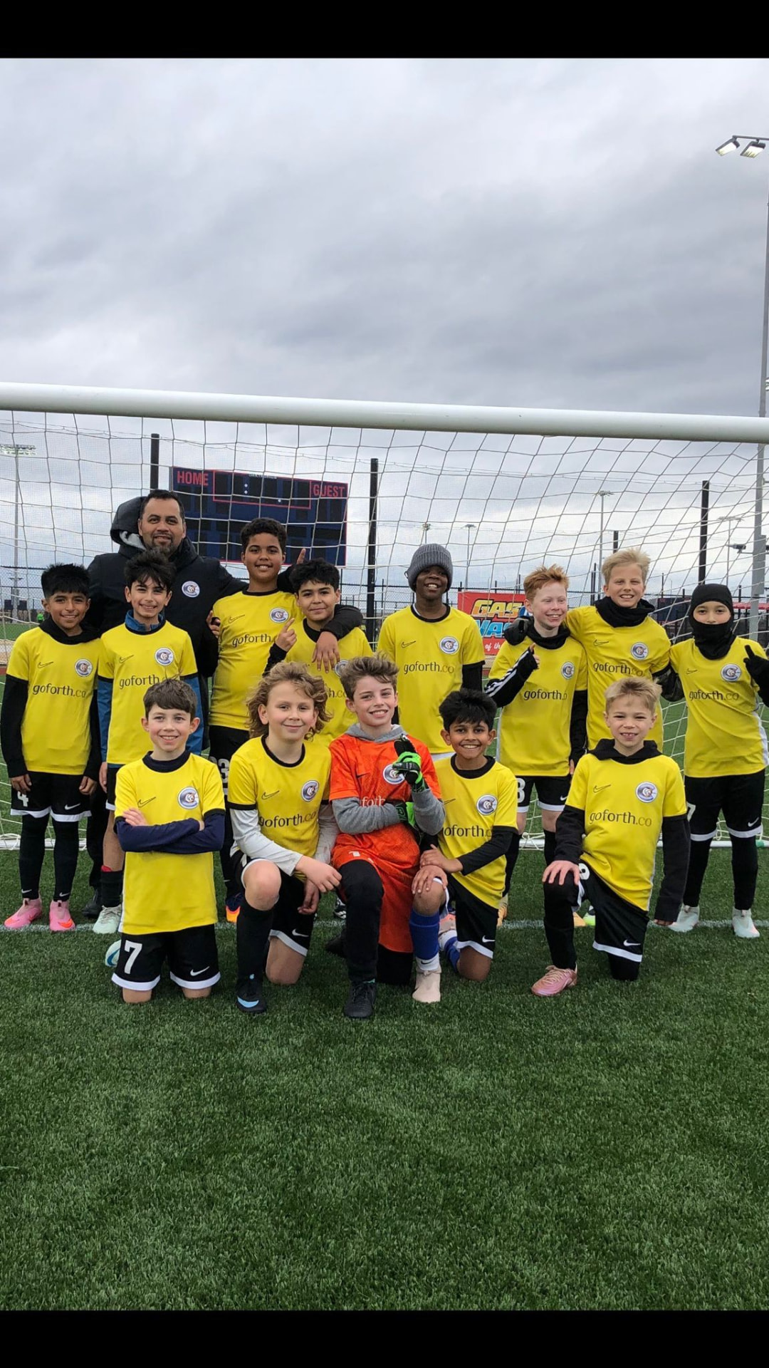 WCOB FC players and coach at the National League Cup finals
